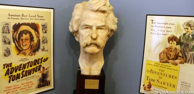 Twain's head flanked by posters of movies he never saw.