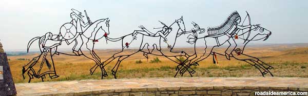 Outlines of Indians on horseback.