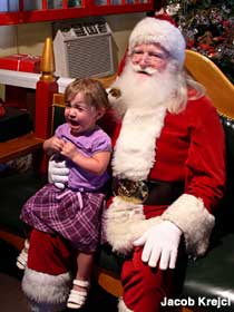 Santa delights another child.