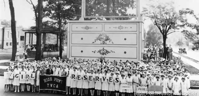 The YWCA Girl Reserves pose at the giant bureau in the 1920s.