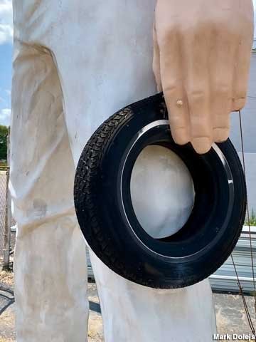 Muffler Man holding a tire - White's Tire.