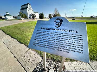 Historical plaque explains the Walk of Fame's origins.