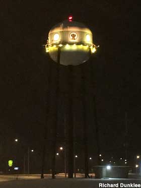 UFO water tower at night.
