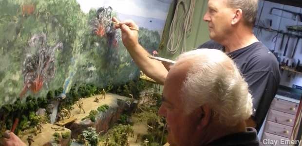 Rod Hildebrand (sitting) and Clay Emery (standing) work on their War in the Pacific diorama.