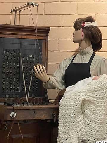 Switchboard operator with a baby and a head wound.