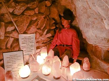 Gift shop dummy basks in the glow of salt lamps.