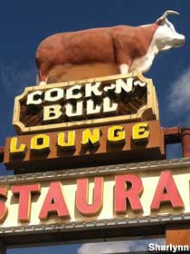 Sign and statue for Cock-n-Bull Lounge.