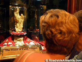 Casino patrons gaze at the World's Largest Gold Nugget.