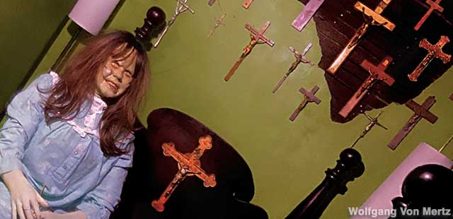 Possessed Regan and crucifix collection in the Exorcist Bedroom.