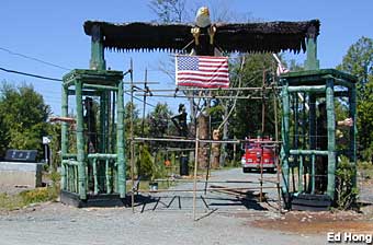 POW cages and bald eagle sculpture.