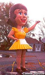 bulbous-headed waitress statue.