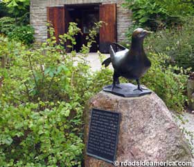Bronze Martha attracts visitors to her memorial aviary.
