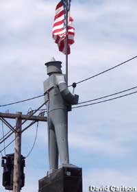 Tin Man holding an American flag.