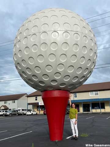 Giant golf ball and tee.