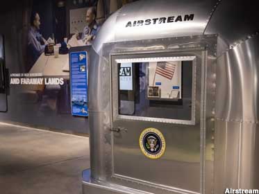 Pose and wave from behind Airstream glass, just like the Apollo 11 astronauts.