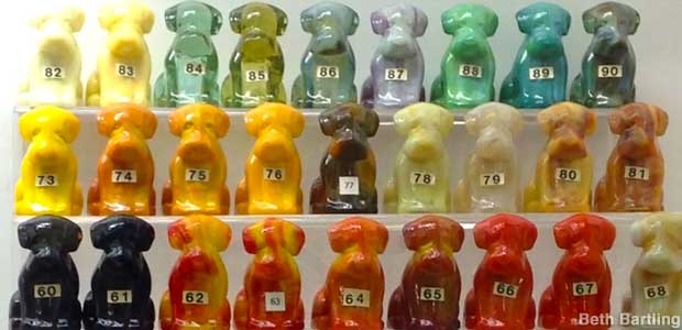Little glass dogs, neatly labeled with numbers.