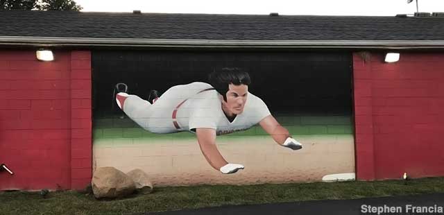Pete Rose flies to first base.