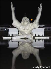 Jesus statue at night.