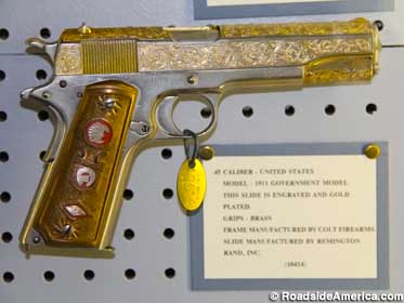 Gold-plated .45 caliber pistol.