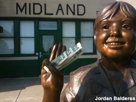 Girl Scout cookie sale statue.