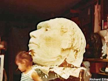 1970: Caveman's plaster head in sculptor's garage. Daughter Vanessa provides scale.