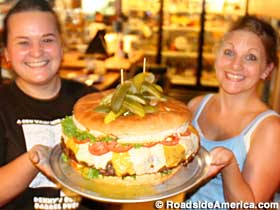 Watiresses deliver a 15-pound hamburger.