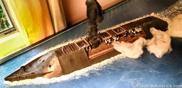 Cat crew fires a broadside from the Confederate ironclad Virginia.