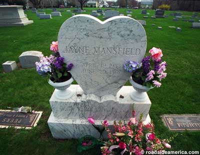 Headstone and flowers.