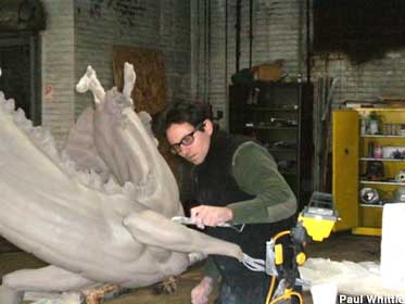 Paul Whittle carving a dragon.