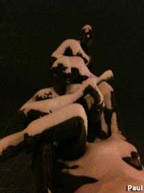 Snow covered statue.