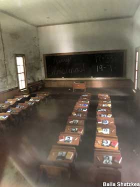 Miniature schoolhouse classroom.