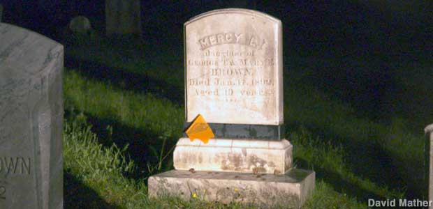 Mercy L. Brown's tombstone at night.