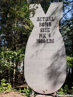 Plywood cutout of bomb.