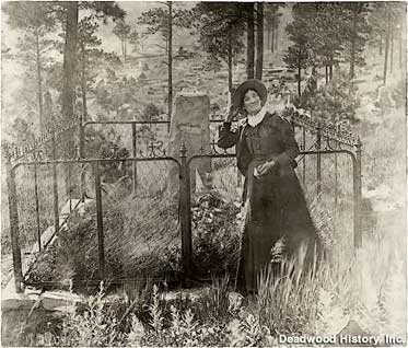 Calamity Jane visits Wild Bill's grave.