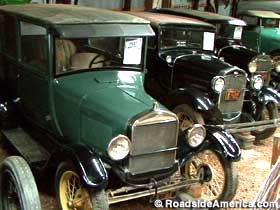 Early 20th century motor cars.