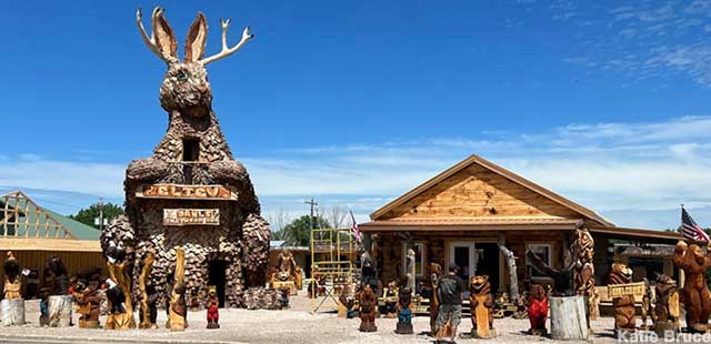 Giant Jackalope stands in the parking lot of the former Wall Motel, now a chainsaw-art emporium.
