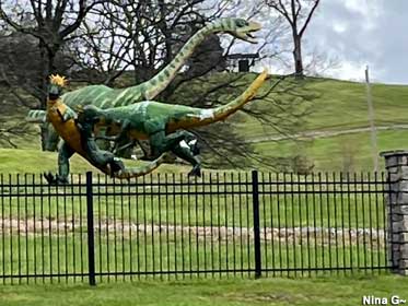 Dinosaurs visible from road.
