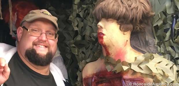 Chris Kastner and a half-eaten corpse, one of his countless Backyard Terrors creations.