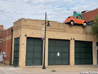 Dinosaur and VW bug on the roof.