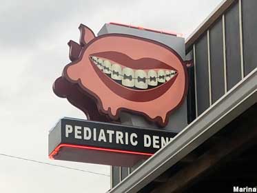 Pig with braces sign.