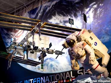 International Space Station replica hangs from the rafters in the Main Plaza.