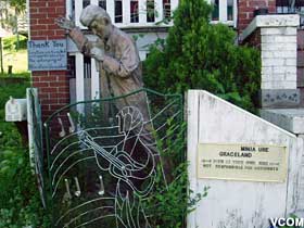 Entrance statue and sign.