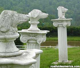 Dog's heads on pillars.