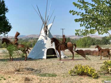Teepee and sculptures.