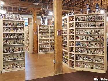 Museum shelves packed with thousands of bobbleheads.