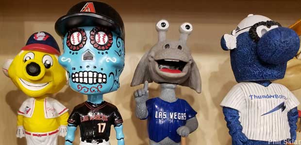 Four sports mascot bobbleheads of weird, colorful creatures.