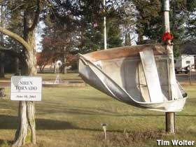 Boat wrapped around pole from 2001 tornado.