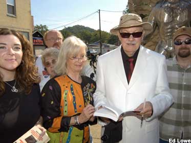 Mothmen Prophecies author John Keel signs books at the 2003 unveiling.