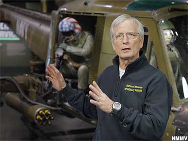 Museum owner Dan Starks explains helicopter warfare in Vietnam.