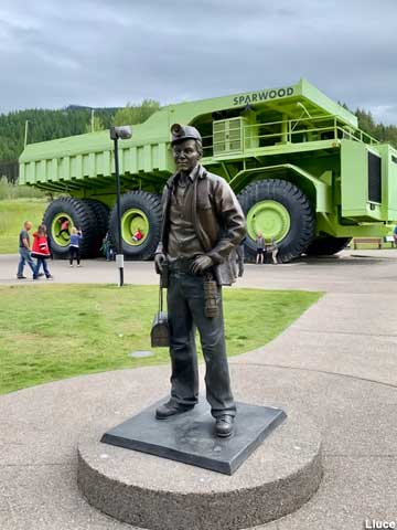 Miner statue and giant truck.